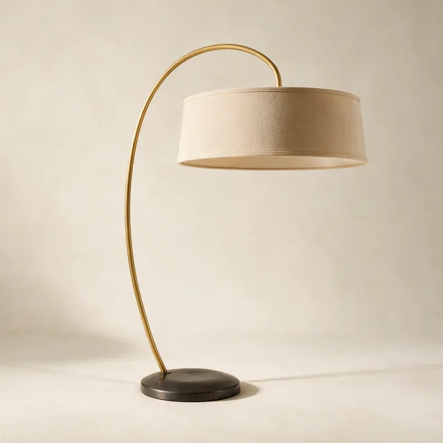 An arched floor reading lamp with a fabric shade