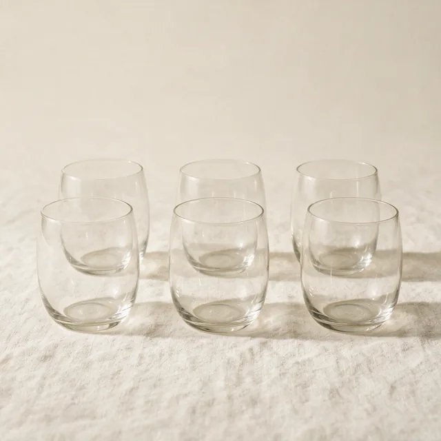 Six plain drinking glasses in two neat rows
