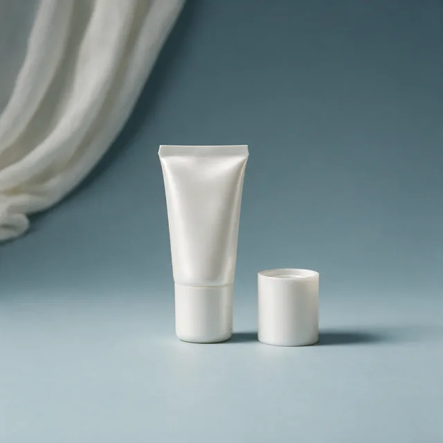 An unlabeled tube of thick hand cream with the cap beside it