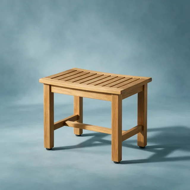 A low teak shower stool with a slatted seat